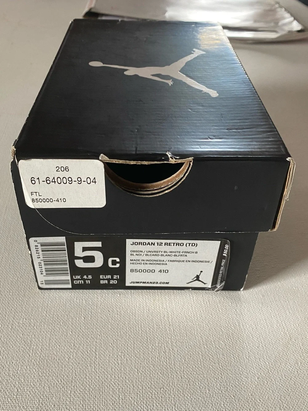 Nike Kids Navy and White Jordan 12’s